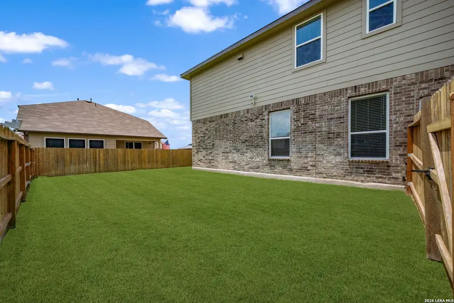 Exterior details and patio area of a home in , Cibolo (Image 24).