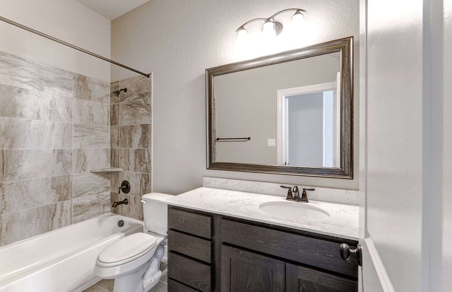 Representative furnished interior of a home built from the 3799 by Ravenna Homes in Artavia 70′, Conroe (Image 28).