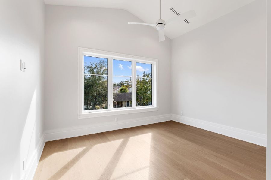 Generously sized guest suite with vaulted ceiling.