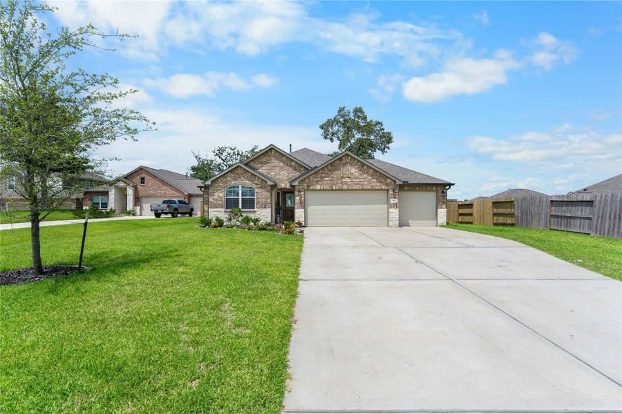 Front exterior of a new home in Wedgewood Forest, Conroe, TX, highlighting curb appeal (Image 1). Front exterior of a new home in Wedgewood Forest, Conroe, TX, highlighting curb appeal (Image 1).