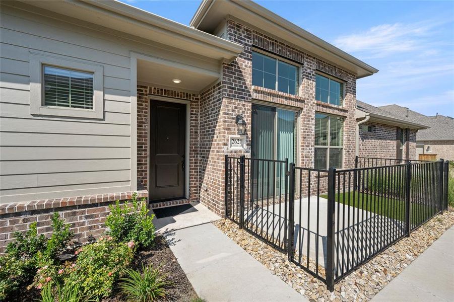 Front exterior of a new home in Mira Lagos, Grand Prairie, TX, highlighting curb appeal (Image 21). Front exterior of a new home in Mira Lagos, Grand Prairie, TX, highlighting curb appeal (Image 21).