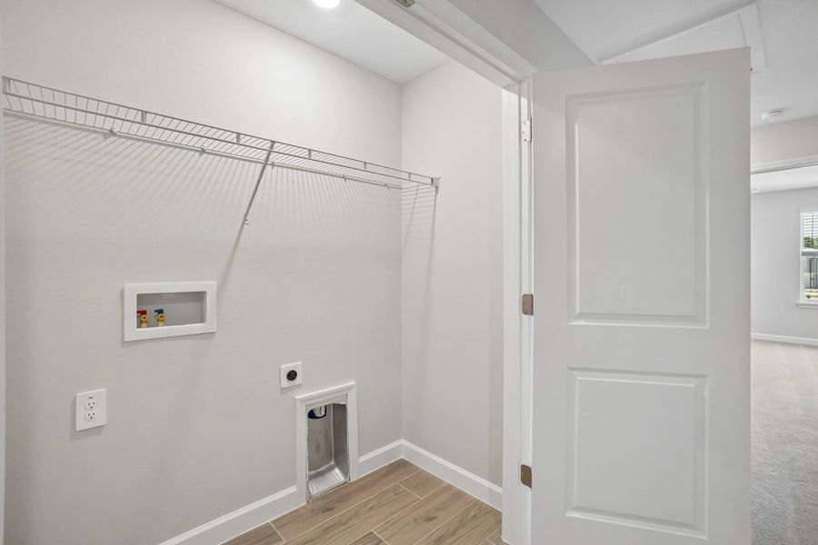 Laundry closet located off the upstairs hallway