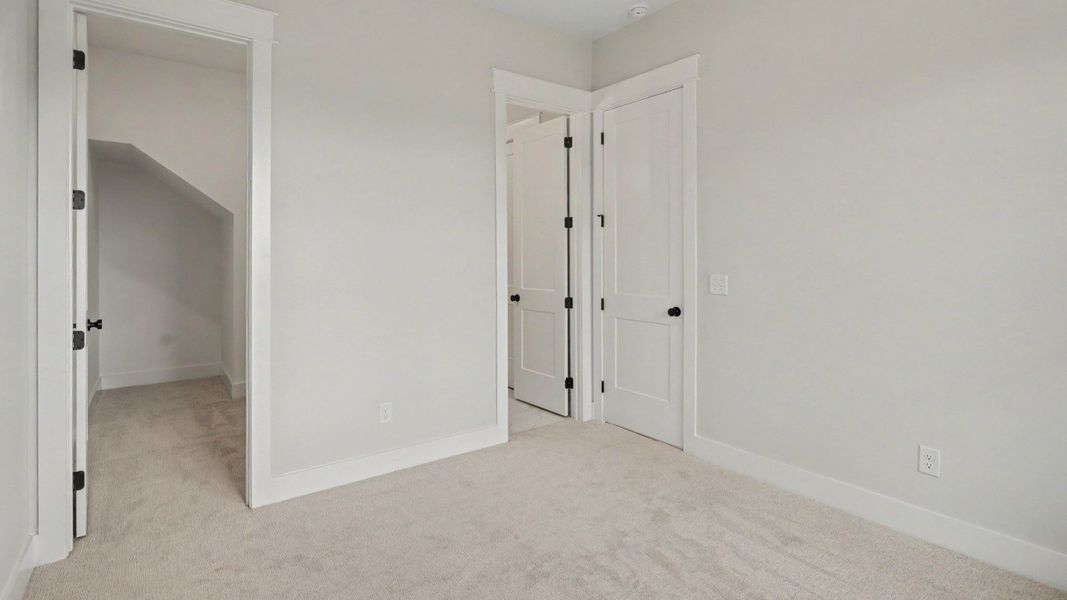 Secondary bedroom with walk-in closet