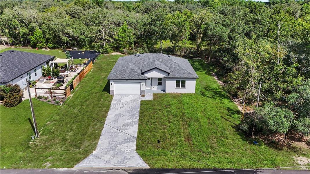 Front exterior of a new home in , Ocala, FL, highlighting curb appeal (Image 25).