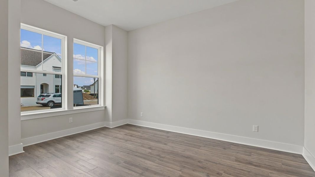 Two sizable windows allow for natural light into the living space.