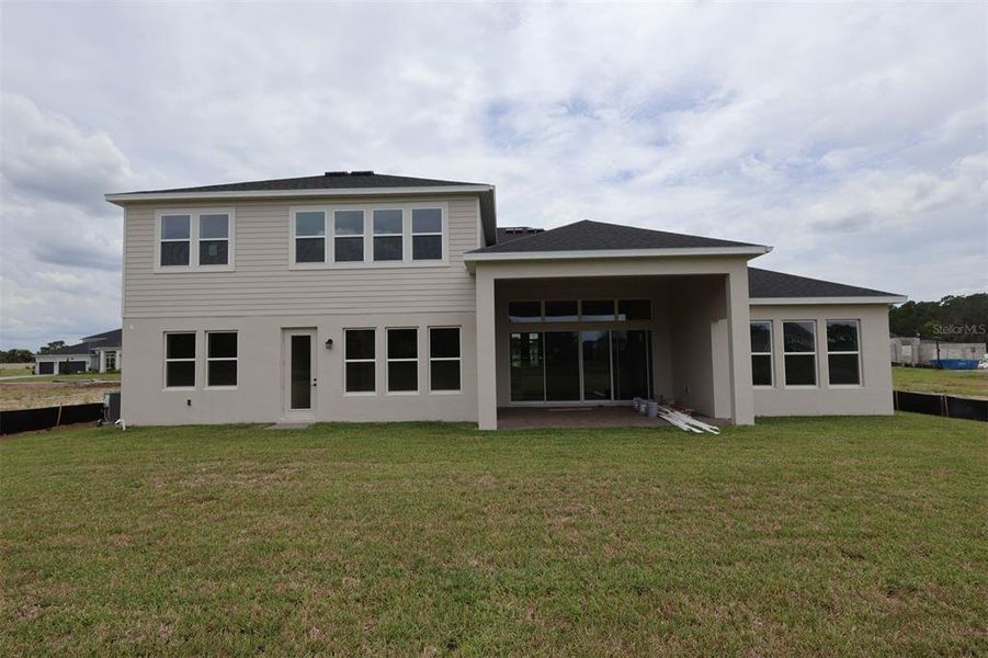 Exterior details and patio area of a home in Solace at Corner Lake, Orlando (Image 2). Exterior details and patio area of a home in Solace at Corner Lake, Orlando (Image 2).