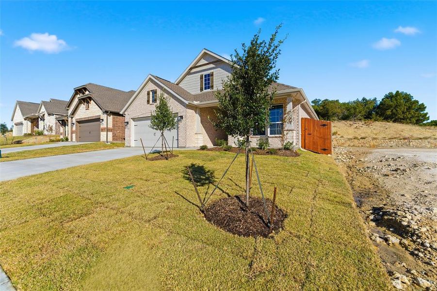 Front exterior of a new home in Waterford Park, Weatherford, TX, highlighting curb appeal (Image 2).