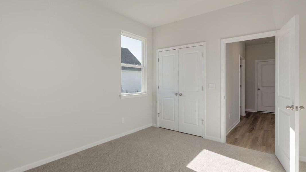 Representative unfurnished interior of a home built from the HARBOR OAK by D.R. Horton in Indigo Preserve, Leland (Image 28).