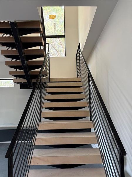 Hand made 4" steps made individually out of white Oak on the Rif.  Hand made railings also.