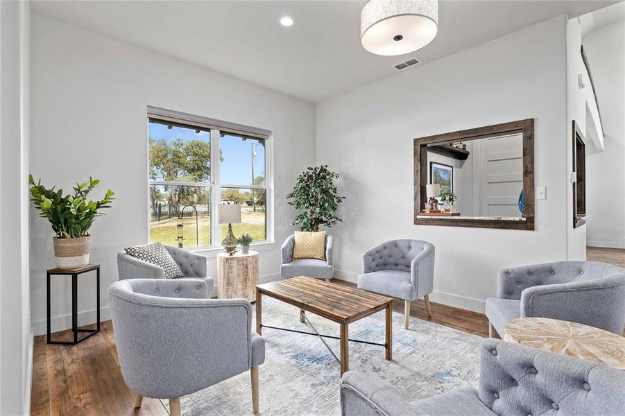 Sitting room featuring recessed lighting and wood finished floors