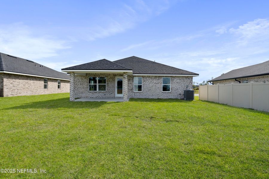 Exterior details and patio area of a home in Shadow Crest at Rolling Hills, Green Cove Springs (Image 4).