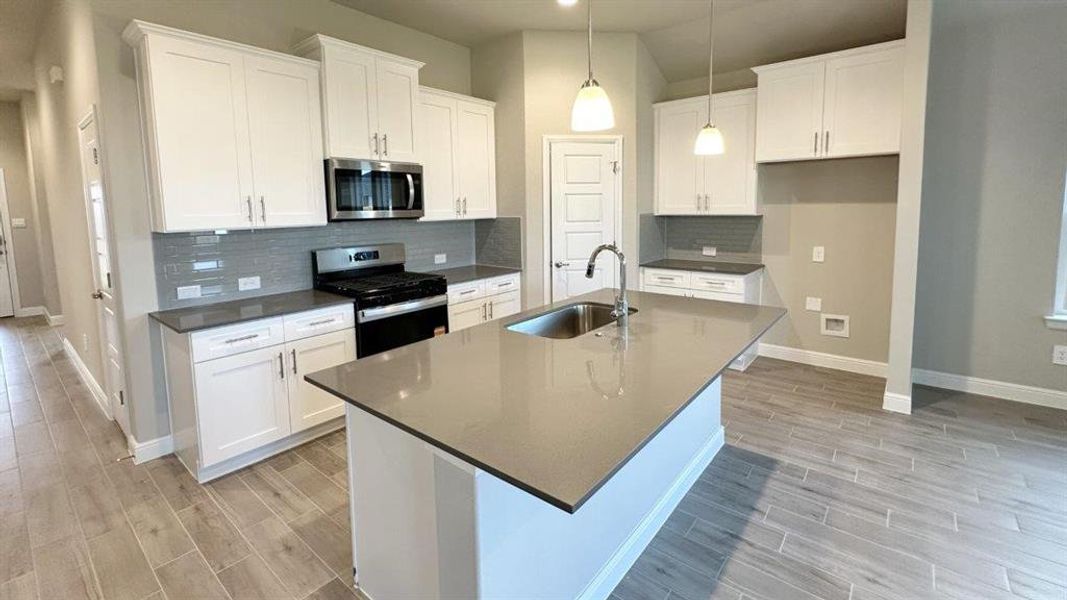 Kitchen - All Home and community information, including pricing, included features, terms, availability and amenities, are subject to change at any time without notice or obligation. All Drawings, pictures, photographs, video, square footages, floor plans, elevations, features, colors and sizes are approximate for illustration purposes only and will vary from the homes as built.