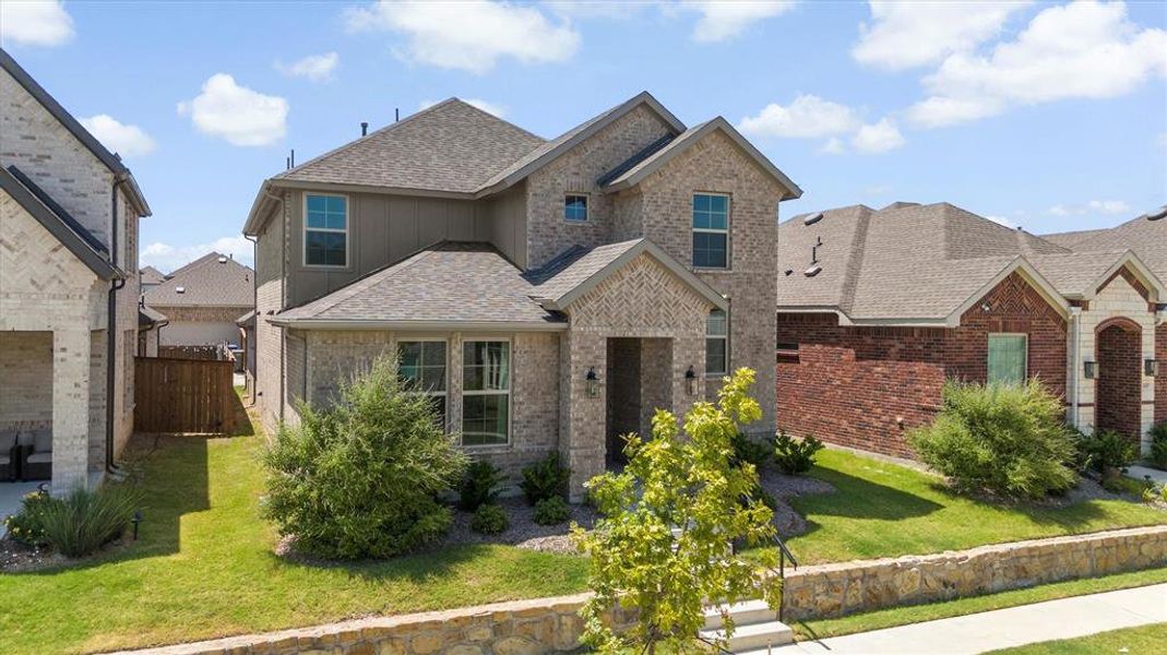 Front exterior of a new home in Riverset, Garland, TX, highlighting curb appeal (Image 2). Front exterior of a new home in Riverset, Garland, TX, highlighting curb appeal (Image 2).
