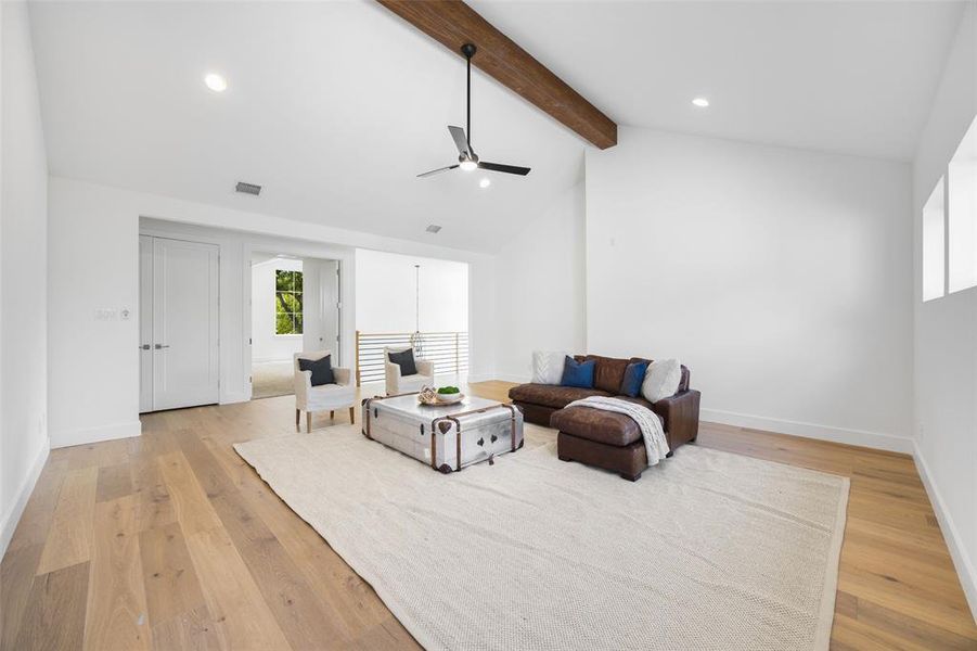 Game room with beam ceiling, light wood finished floors, ceiling fan, recessed lighting, and high vaulted ceiling Game room with beam ceiling, light wood finished floors, ceiling fan, recessed lighting, and high vaulted ceiling