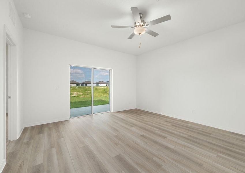 A sliding door in the family room leads to the covered back patio A sliding door in the family room leads to the covered back patio