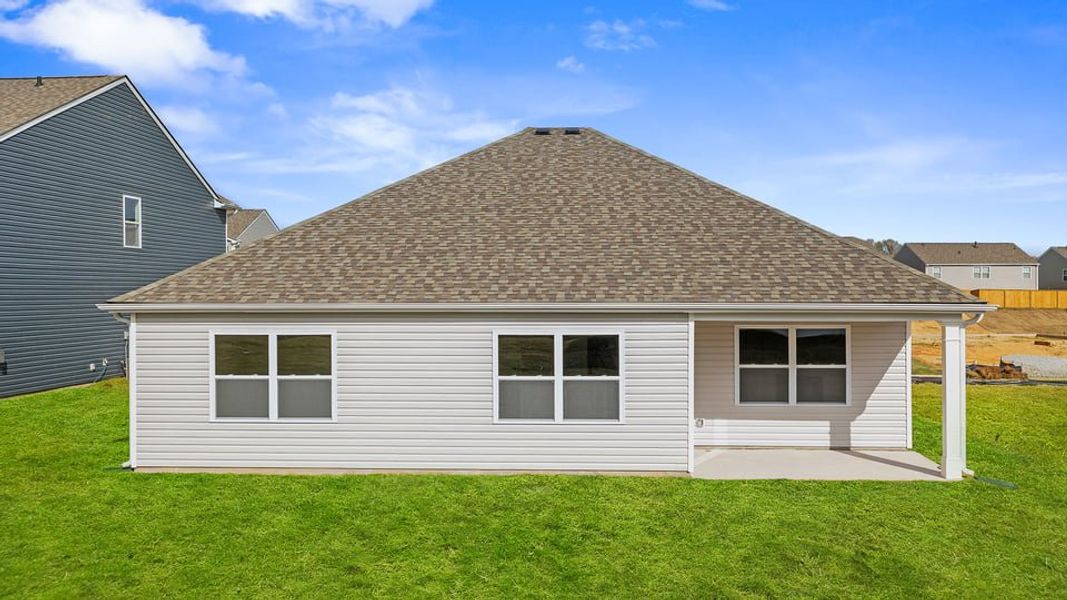 Exterior details and patio area of a home in Durbin Meadows Traditions, Fountain Inn (Image 4).