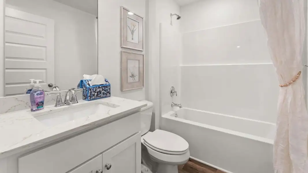 Furnished interior view inside a new home in Magnolia at the Bluffs Phase 3, Freeport (Image 27).
