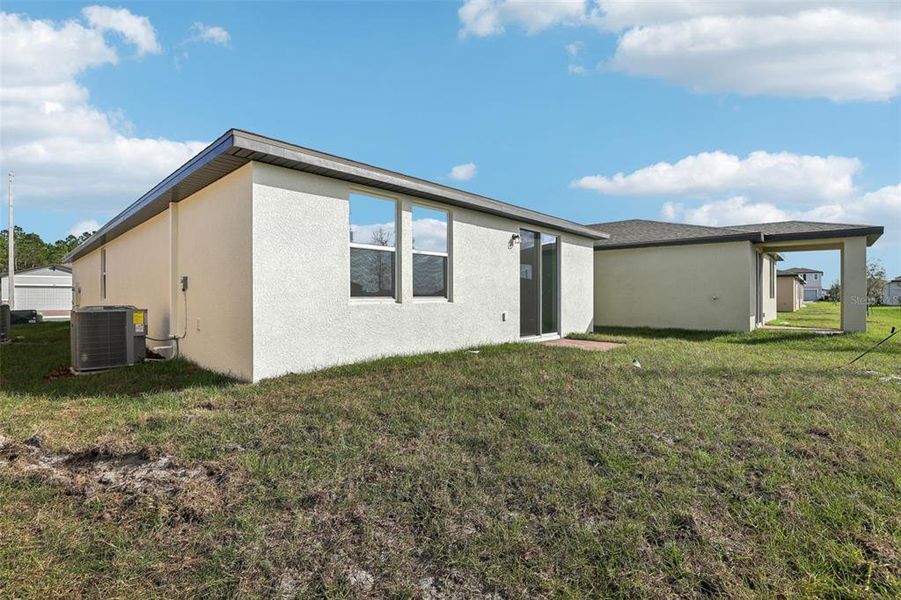 Exterior details and patio area of a home in Lake Deer Estates - Classic Series, Poinciana (Image 21).