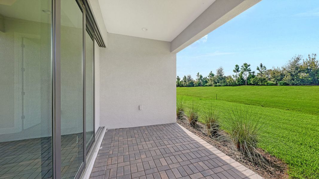 Exterior details and patio area of a home in Palm Grove Real Estate and Homes for Sale in Lakewood Ranch, FL - Neal Communities, Lakewood Ranch (Image 23). Exterior details and patio area of a home in Palm Grove Real Estate and Homes for Sale in Lakewood Ranch, FL - Neal Communities, Lakewood Ranch (Image 23).