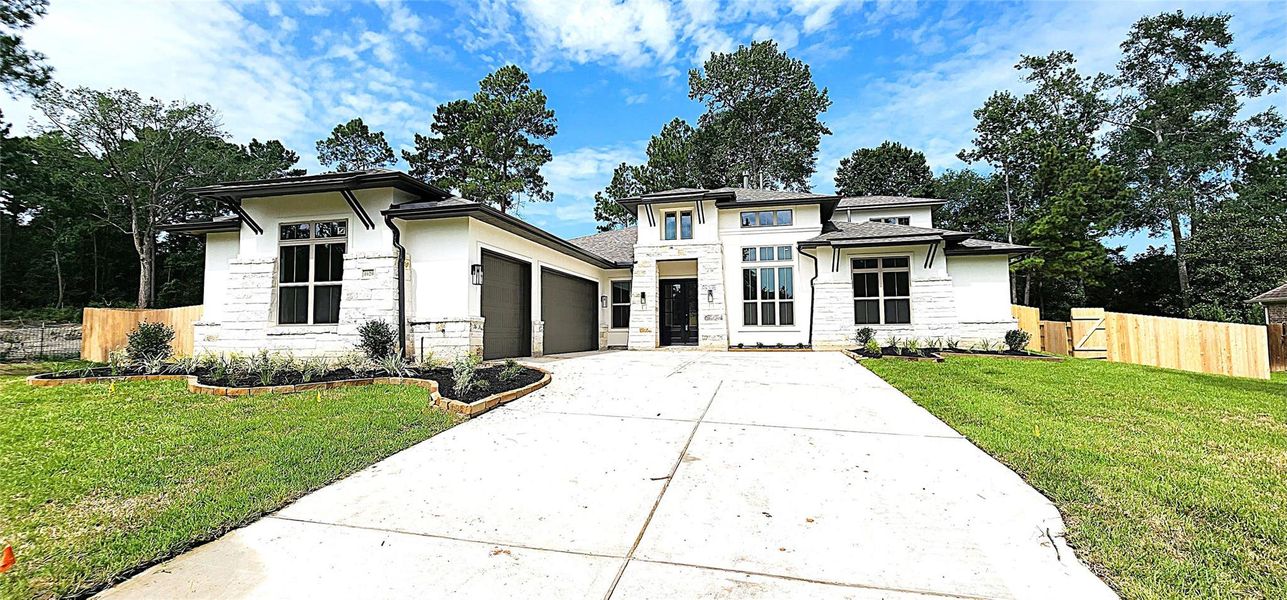 Front exterior of a new home in Stewart’s Forest, Conroe, TX, highlighting curb appeal (Image 16). Front exterior of a new home in Stewart’s Forest, Conroe, TX, highlighting curb appeal (Image 16).