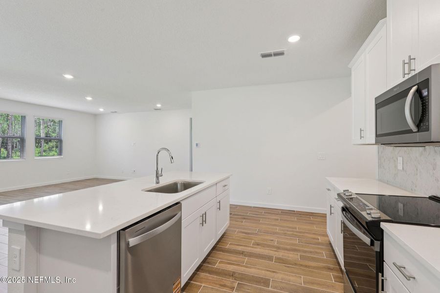 Furnished interior view inside a new home in Colbert Landings, Palm Coast (Image 6).