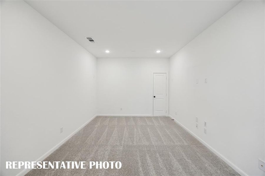 This spacious media room with adjacent gaem room creates the ultimate family entertainment area.