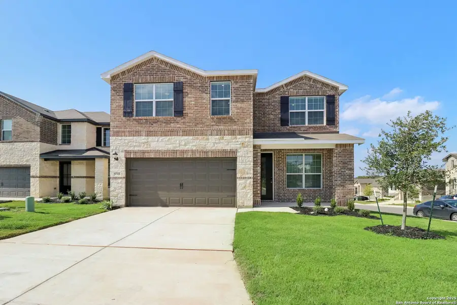 Front exterior of a new home in Thomas Pond, San Antonio, TX, highlighting curb appeal (Image 2). Front exterior of a new home in Thomas Pond, San Antonio, TX, highlighting curb appeal (Image 2).