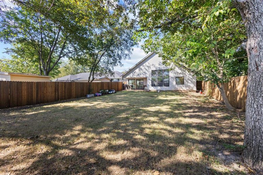 Fenced backyard featuring a patio area