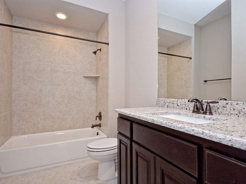 Representative furnished interior of a home built from the Madera II by Giddens Homes in Scofield Farms Estates, Georgetown (Image 206).