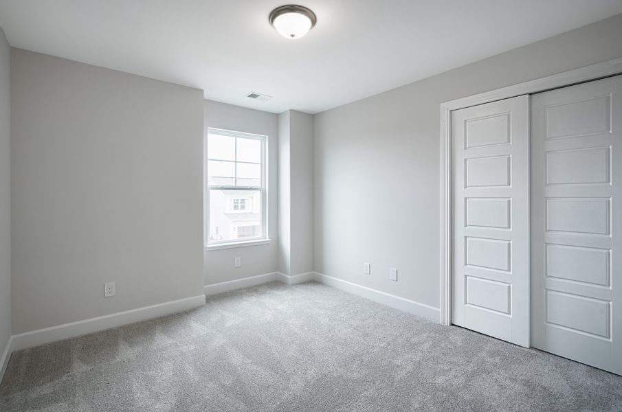 Representative unfurnished interior of a home built from the The McKee Manor by Cothran Homes in Holly Ridge, Greenville (Image 40). Representative unfurnished interior of a home built from the The McKee Manor by Cothran Homes in Holly Ridge, Greenville (Image 40).