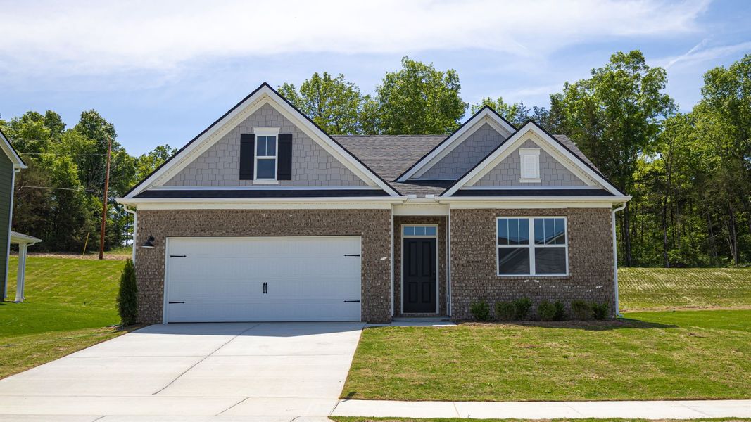 Front exterior of a new home in Savannah Lakes, Lewisburg, TN, highlighting curb appeal (Image 1). Front exterior of a new home in Savannah Lakes, Lewisburg, TN, highlighting curb appeal (Image 1).