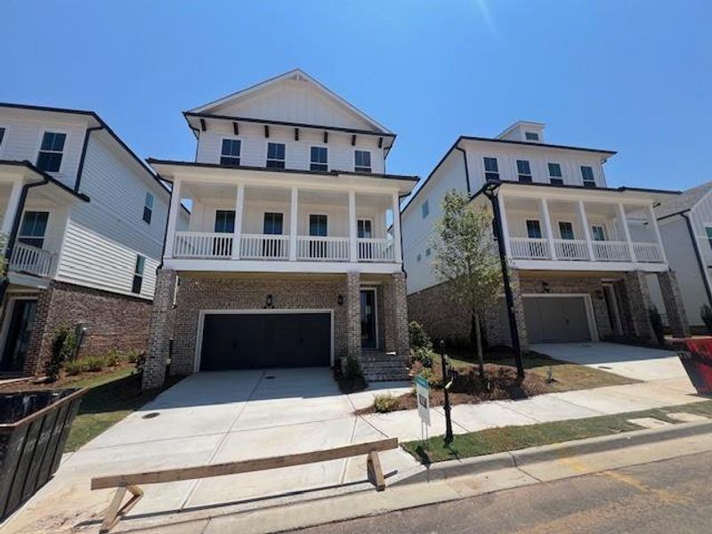 Front exterior of a new home in Palisades Single Family, Cumming, GA, highlighting curb appeal (Image 25).