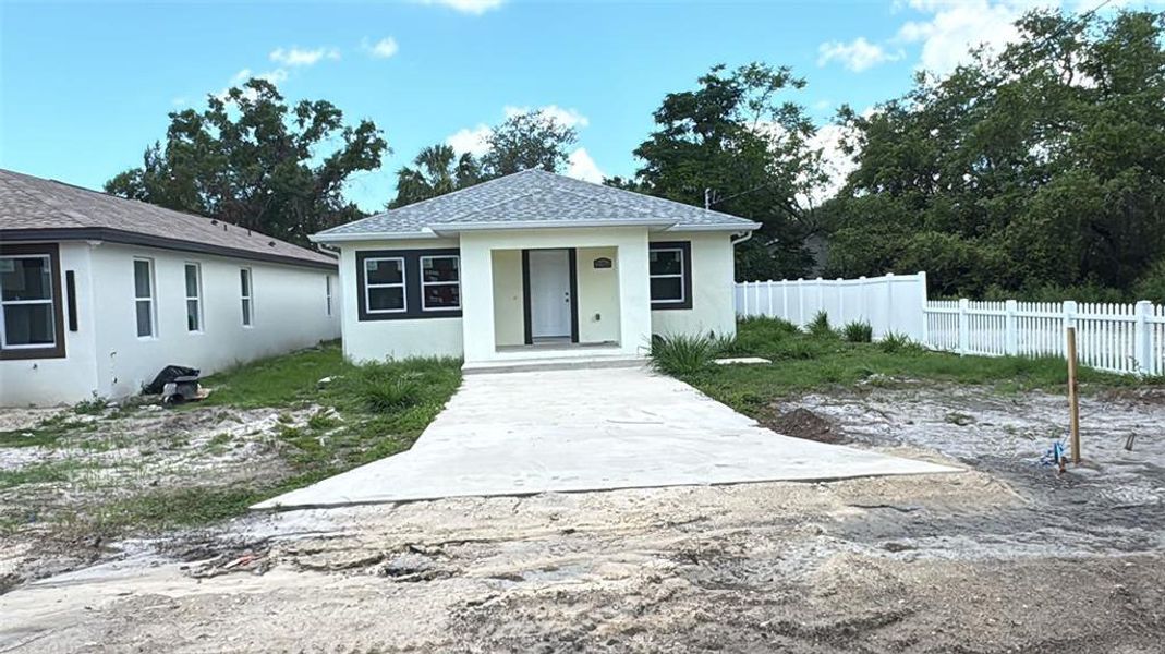 Front exterior of a new home in , Tampa, FL, highlighting curb appeal (Image 2).