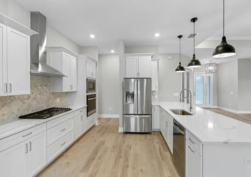 The fully loaded kitchen includes stainless steel appliances.