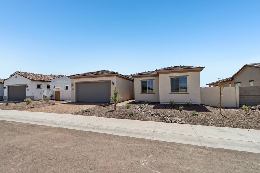 Front exterior of a new home in Estrella, Goodyear, AZ, highlighting curb appeal (Image 20).