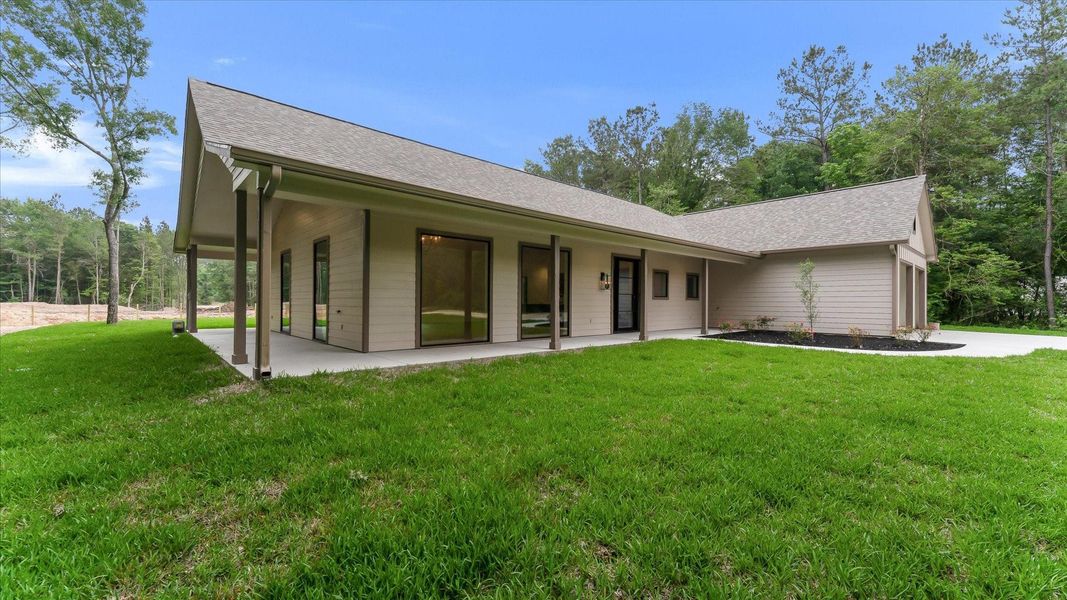 Exterior details and patio area of a home in , Conroe (Image 3).