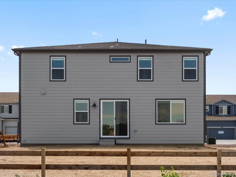 Front exterior of a new home in Poudre Heights: The Lakes Collection, Windsor, CO, highlighting curb appeal (Image 1).