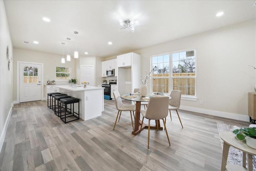 Dining space featuring light hardwood / wood-style floors