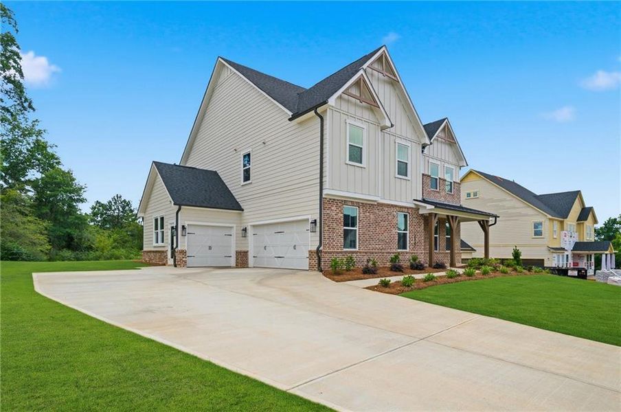 Front exterior of a new home in Acacia, Cumming, GA, highlighting curb appeal (Image 23). Front exterior of a new home in Acacia, Cumming, GA, highlighting curb appeal (Image 23).
