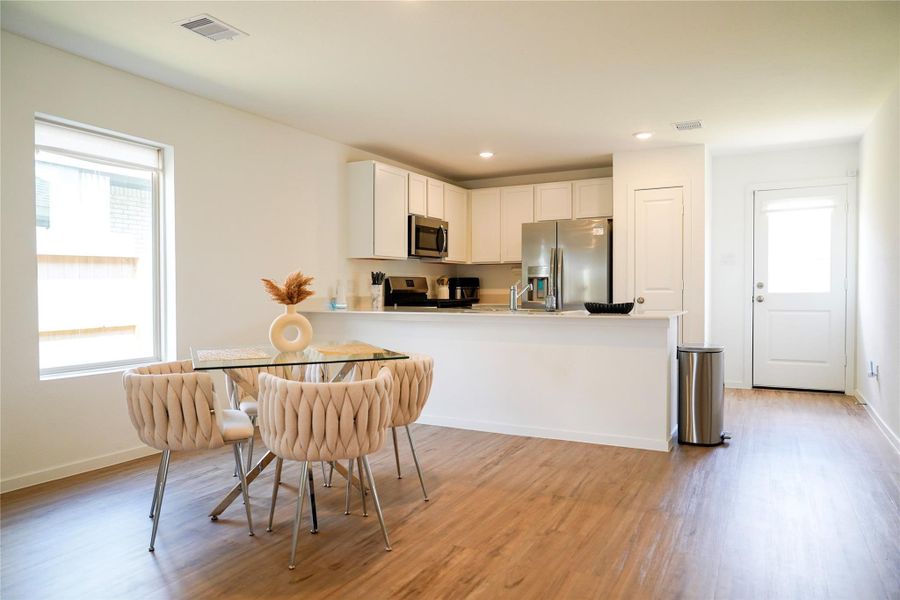 Furnished interior view inside a new home in Sunterra, Katy (Image 16).
