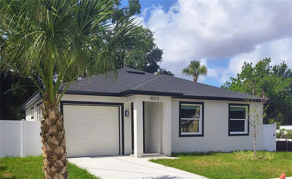 Front exterior of a new home in , Tampa, FL, highlighting curb appeal (Image 1). Front exterior of a new home in , Tampa, FL, highlighting curb appeal (Image 1).