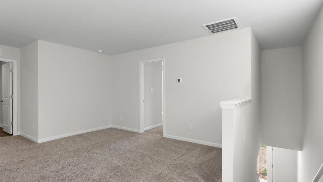 Representative unfurnished interior of a home built from the WOODSTOCK by D.R. Horton in Surfside Landing, Hubert (Image 23).
