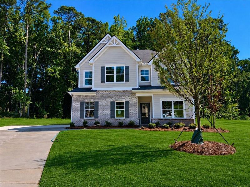Front exterior of a new home in Stephens Landing, Loganville, GA, highlighting curb appeal (Image 1). Front exterior of a new home in Stephens Landing, Loganville, GA, highlighting curb appeal (Image 1).
