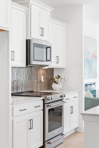 Representative furnished interior of a home built from the Tilley by McKee Homes in Anchors Bend Townes, Wilmington (Image 6).