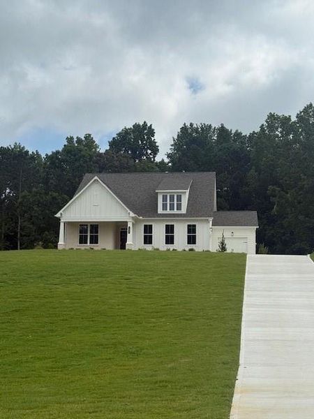 Front exterior of a new home in , Canton, GA, highlighting curb appeal (Image 12).