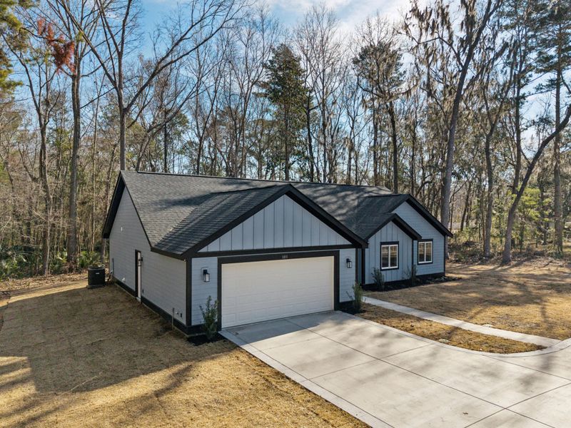 Front exterior of a new home in , Moncks Corner, SC, highlighting curb appeal (Image 23). Front exterior of a new home in , Moncks Corner, SC, highlighting curb appeal (Image 23).