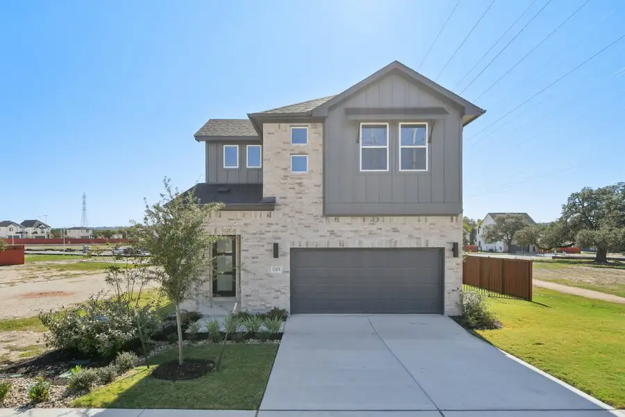 Front exterior of a new home in Foxfield, Austin, TX, highlighting curb appeal (Image 1). Front exterior of a new home in Foxfield, Austin, TX, highlighting curb appeal (Image 1).
