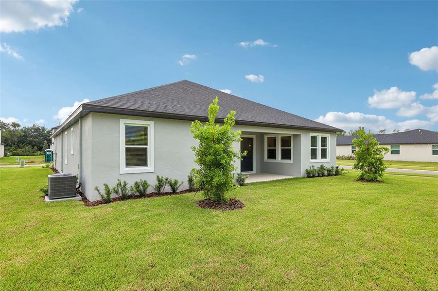Exterior details and patio area of a home in , Ormond Beach (Image 26).