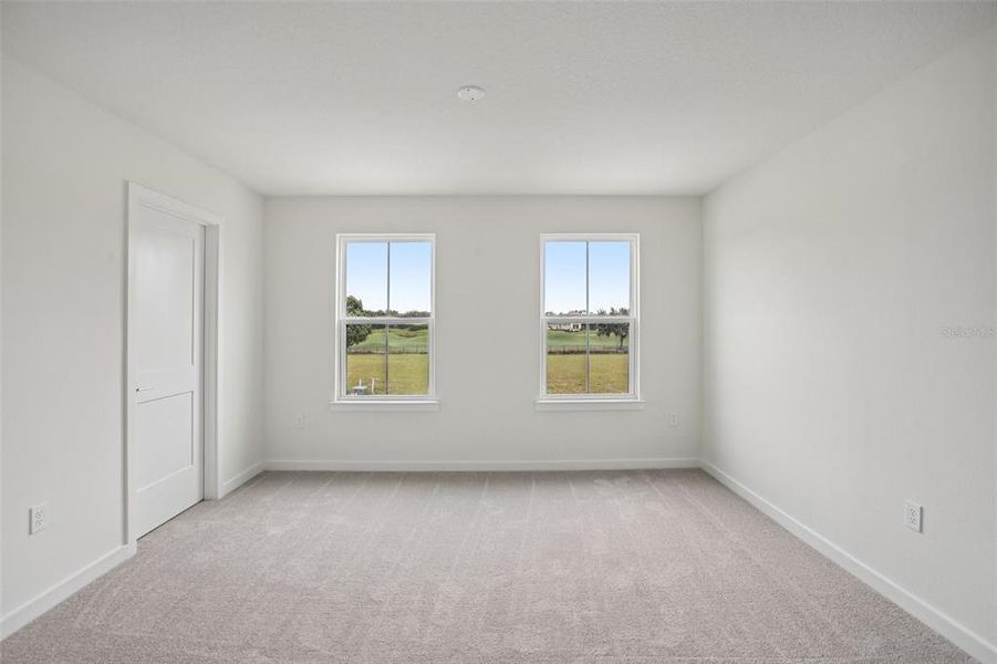 Spacious, unfurnished interior of a new home in Grasslands West, Lakeland (Image 17).