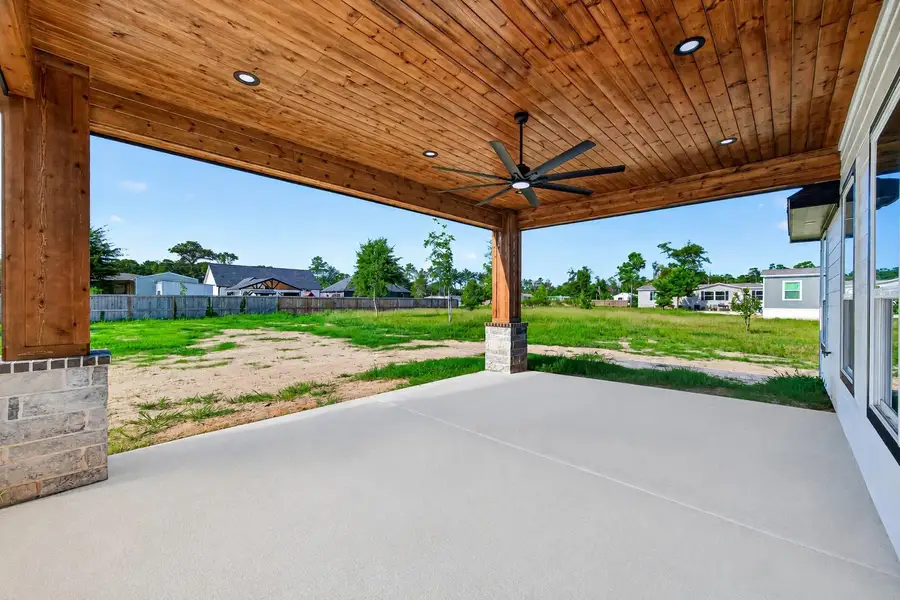 Oversized covered patio extends the home's living space outdoors.